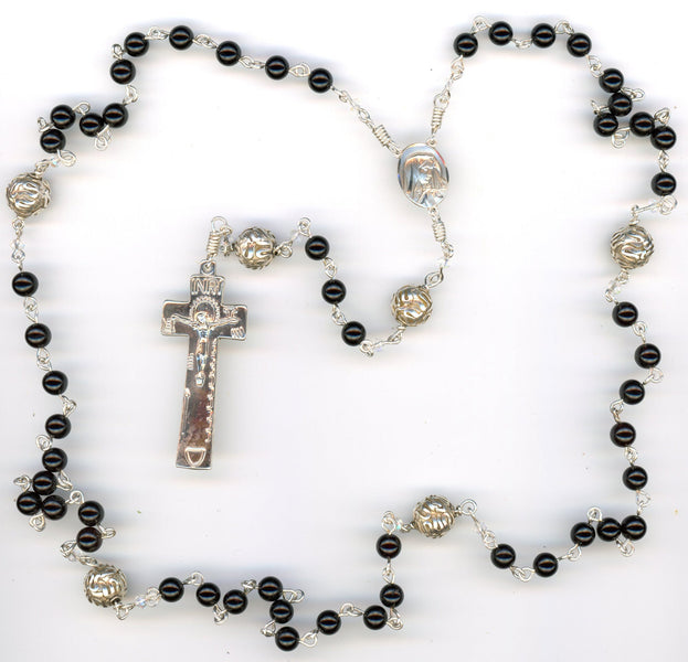 MAKING HANDMADE ROSARIES.